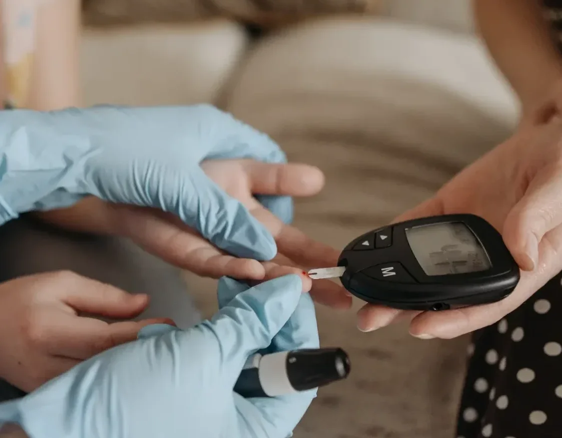 Person checking diabetes with the use of glucose monitor