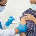 Old Woman taking covid-19 vaccine